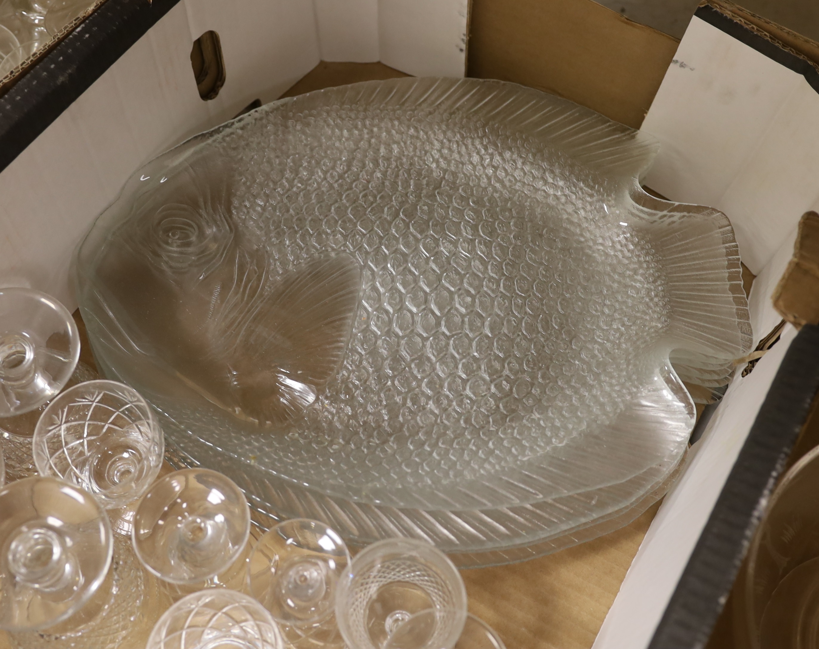 A quantity of mixed cut and moulded glass including beakers, bowls and a set of six fish shaped serving platters (approx 78)